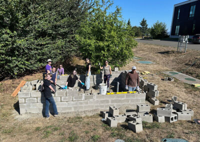 Middle and High School students build a greenhouse