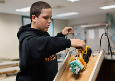 Students design & test car crumble zones in science lab