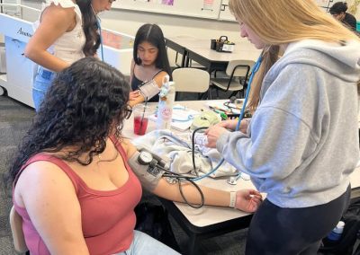 Sports Medicine students practice taking vital signs